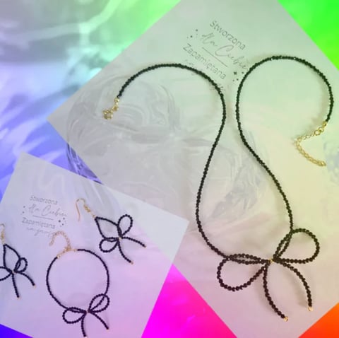 Two beaded necklaces with bow charms and packaging featuring hand-drawn bow designs